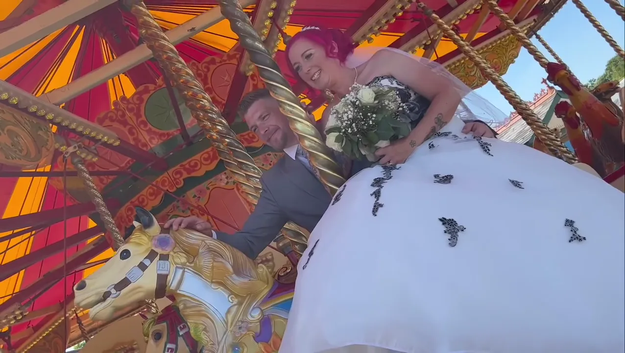 Couple on a fairground carousel